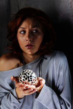 scared redhair with a mirror ball