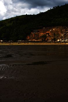 house cabin  people  river   palm  rock stone branch hill lagoon and coastline in madagascar nosy be
