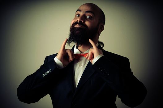  funny elegant bearded man on vignetting background