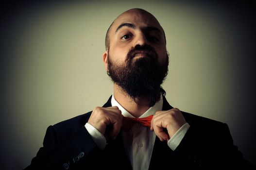  funny elegant bearded man on vignetting background