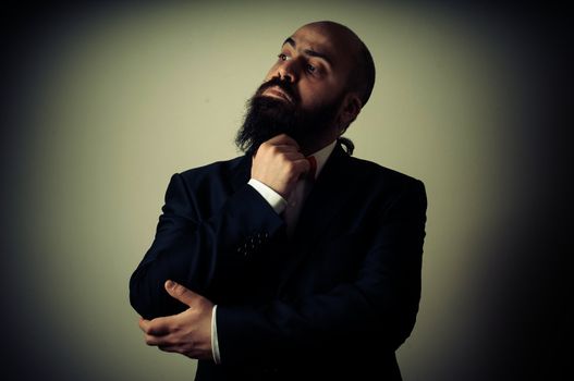  funny elegant bearded man on vignetting background