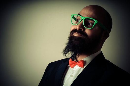  funny elegant bearded man on vignetting background