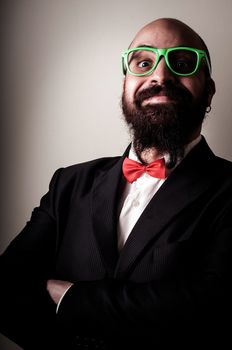  funny elegant bearded man on vignetting background