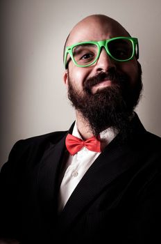  funny elegant bearded man on vignetting background