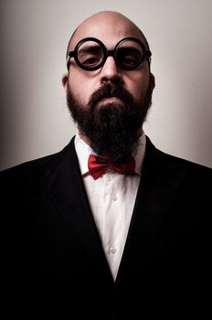 funny elegant bearded man on vignetting background