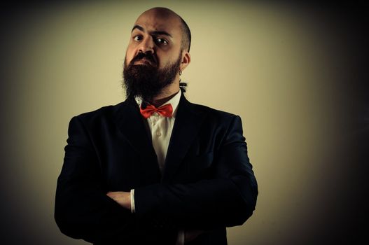  funny elegant bearded man on vignetting background