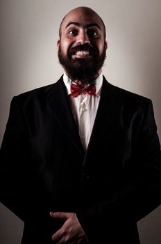  funny elegant bearded man on vignetting background