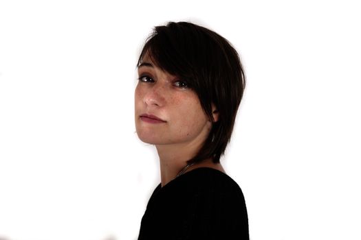 variation of expression on the face of a young brunette woman in studio with a colored scarf