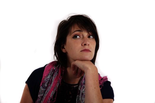 variation portrait of a young brunette woman with colored scraf on studio with her hand under her mounth