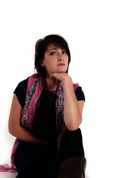 variation portrait of a young brunette woman with colored scraf on studio with her hand under her mounth