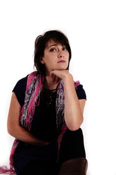 variation portrait of a young brunette woman with colored scraf on studio with her hand under her mounth