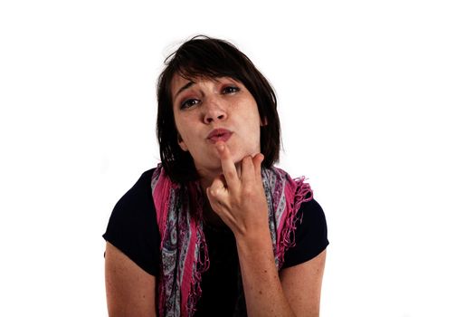 humorous portrait of a young brunette woman with finger of her mouth, colored scarf