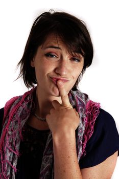 humorous portrait of a young brunette woman with finger of her mouth, colored scarf