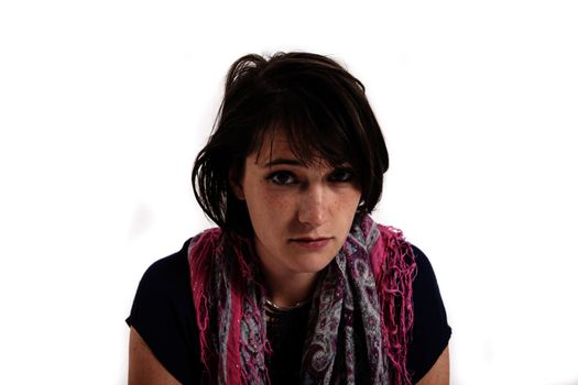 portrait of a young brunette woman with colored scarf looking ahead