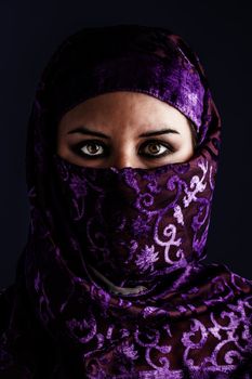 Arab women with traditional veil, eyes intense, mystical beauty