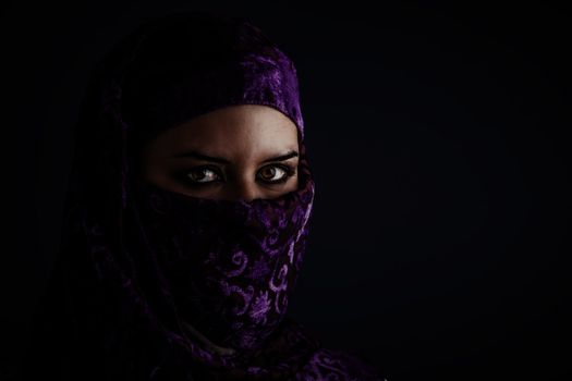Arab women with traditional veil, eyes intense, mystical beauty