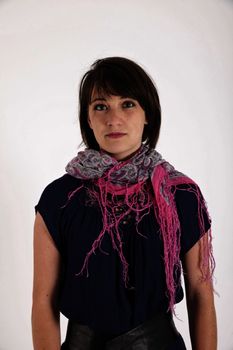 portrait of a young brunette woman with colored scarf looking ahead