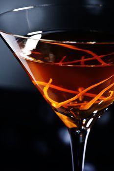 Manhattan cocktail in front of disco lights
