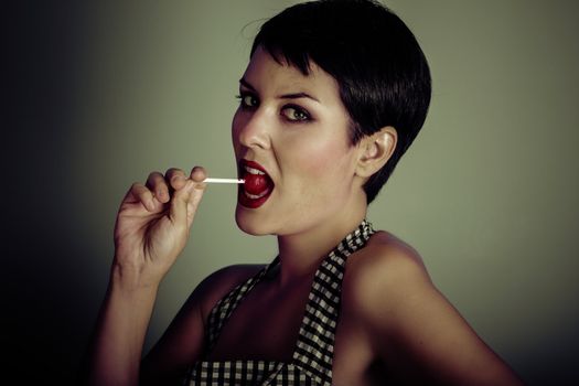 Vintage woman eating a lolly pop