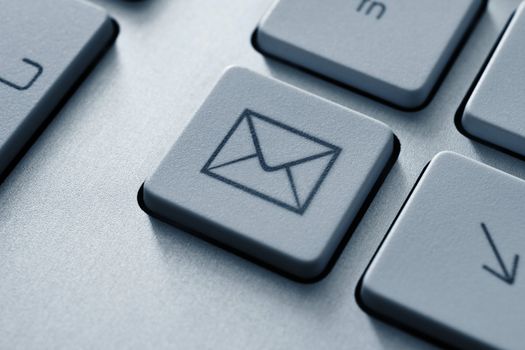 Internet email communication concept with a button on computer keyboard