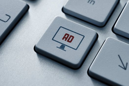 Internet advertising button on modern computer keyboard