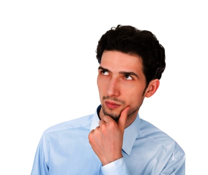 Portrait of a young handsome serious businessman looking up at copyspace. Isolated on white background