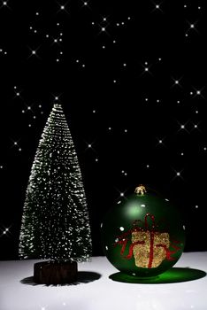 Christmas Tree and Christmas ball on a black background with stars