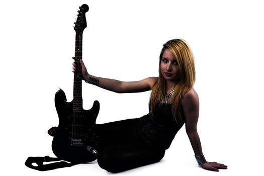 Young blonde holding a black guitar