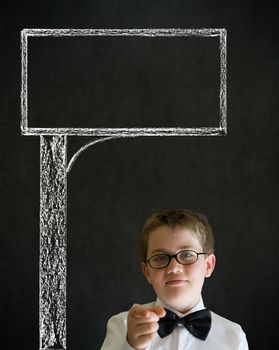 Education needs you thinking boy dressed up as business man with chalk road advertising sign on blackboard background