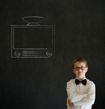 Thinking boy dressed up as business man with chalk tv television on blackboard background