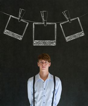 Businessman, teacher or student with chalk instant photograph style photographs on clothes line blackboard background