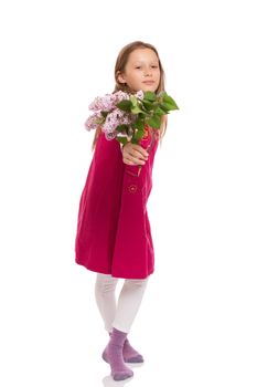 Beautiful young girl with long hair wearing red dress and holding lilac flowers. Isolated on white background.