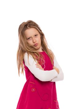 Young girl with long hair wearing red dress and making faces. Isolated on white background.