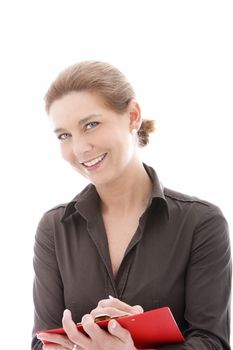 Smiling businesswoman writing on the red folder