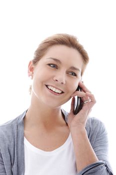 Smiling woman talking on the mobile phone in a close up shot