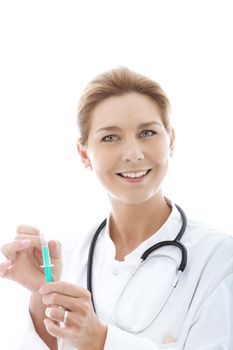 Female doctor with stethoscope and holding a syringe