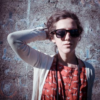 eastern hipster vintage woman with shades at the park