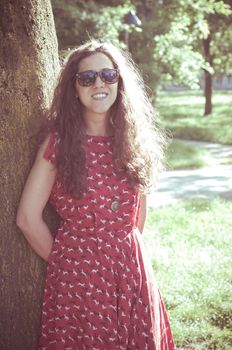 eastern hipster vintage woman with shades at the park