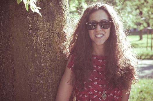eastern hipster vintage woman with shades at the park