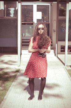 eastern hipster vintage woman with shades at the park