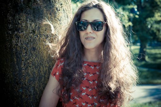 eastern hipster vintage woman with shades at the park