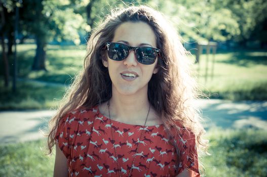 eastern hipster vintage woman with shades at the park