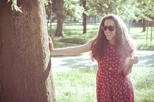eastern hipster vintage woman with shades at the park