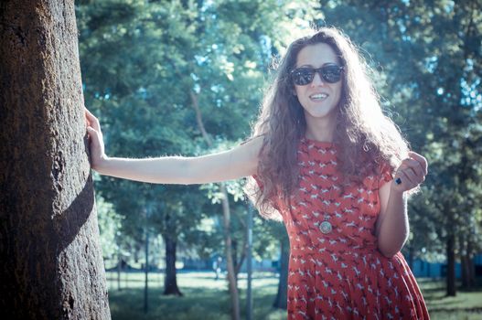 eastern hipster vintage woman with shades at the park