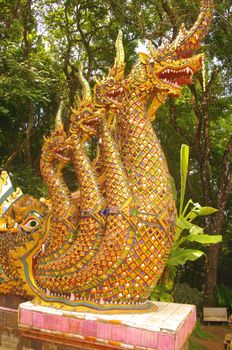 Staircase leading to the temple. A dragon spitting out four dragons on each side mark the start of the staircase. The dragon's tail is 300 steps up. The number five is a sacred number.