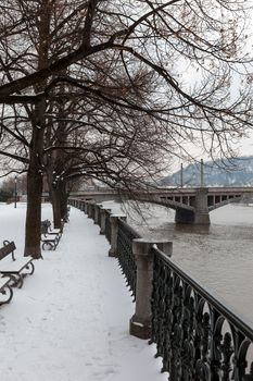 Snow-covered embankment of the Vltava river in Prague. Czech Republic