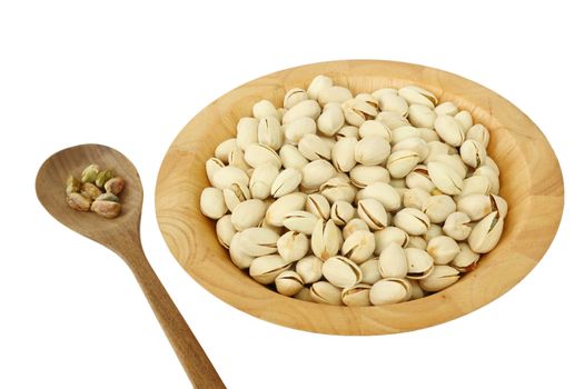 Pistachio nuts in a wooden bowl isolated on white background 