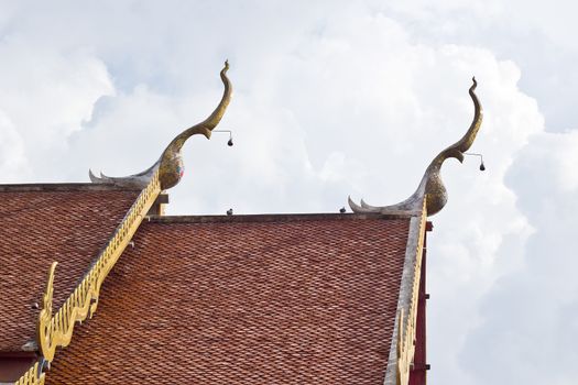 Gable apex on the roof of royal temple in Phrae, thailand.