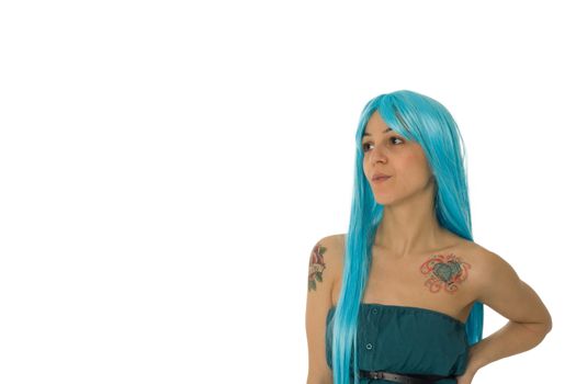 Fashion portrait of a young beautiful woman with a blue wig