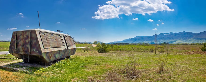 Lika nature scenery and armoured military vehicle, Velebit mountain, Croatia